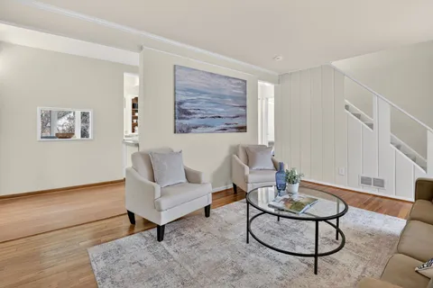a living room with furniture and a rug