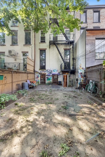 419 Clermont Avenue Brooklyn, NY 11238 - Photo 13 of 14 a view of a house with backyard and sitting area