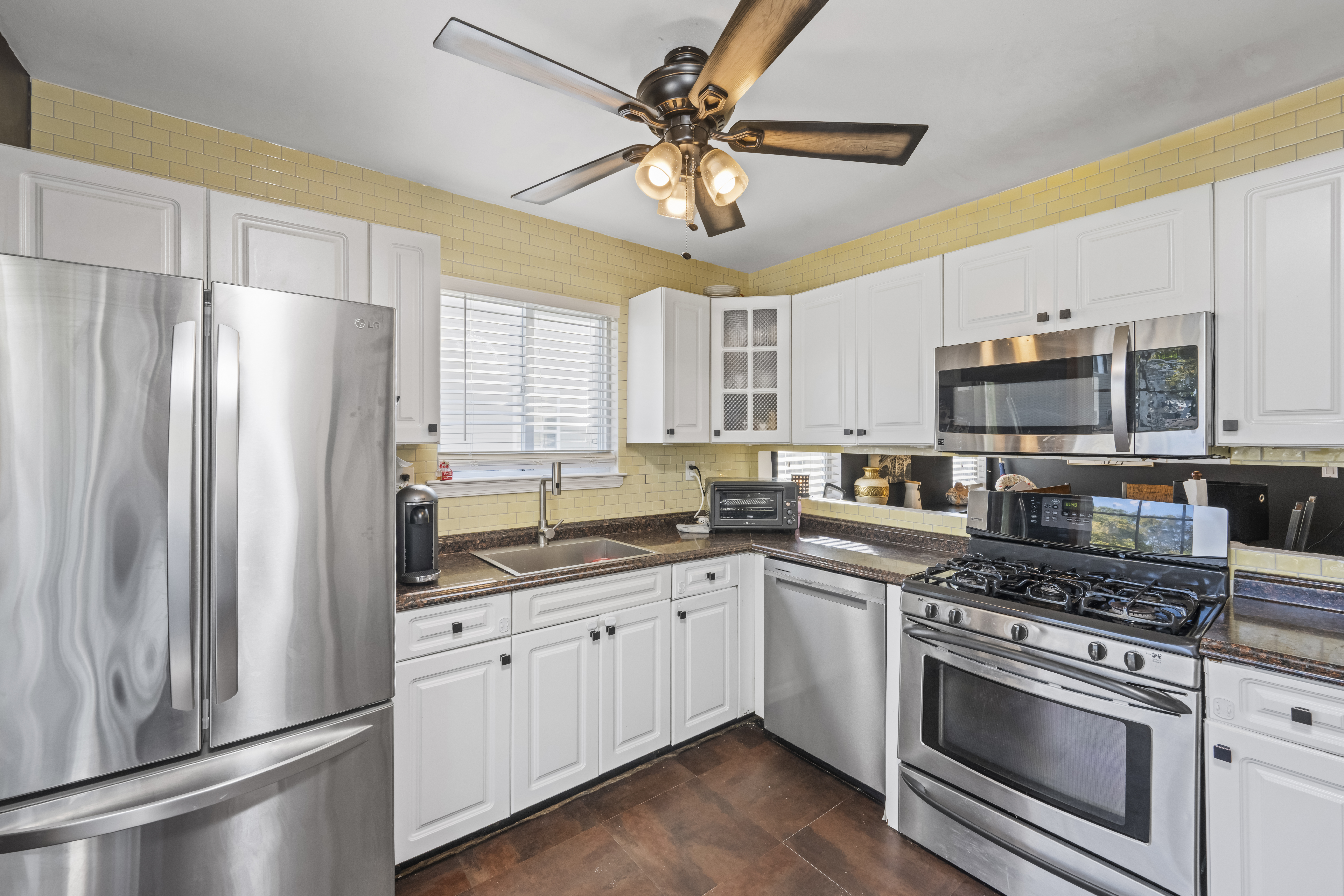 55 Sideview Avenue Staten Island, NY 10314 - Photo 10 of 28 a kitchen with stainless steel appliances a stove a sink and a refrigerator