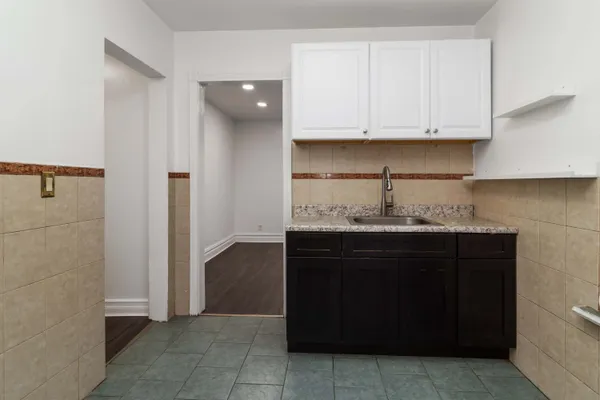 a kitchen with a sink and cabinets