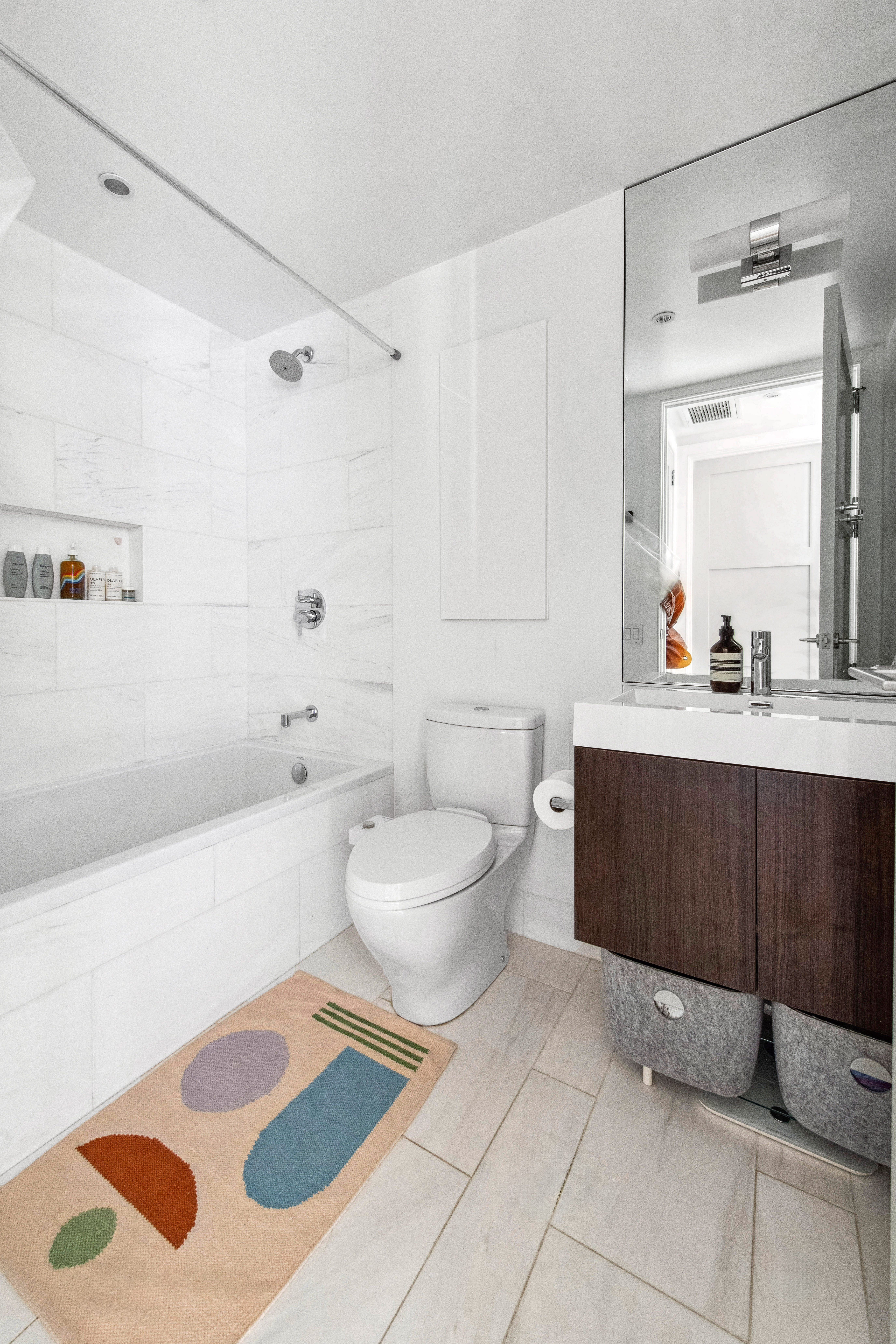 536 East 13th Street, Unit 5F Manhattan, NY 10009 - Photo 11 of 16 a bathroom with a sink a toilet and shower