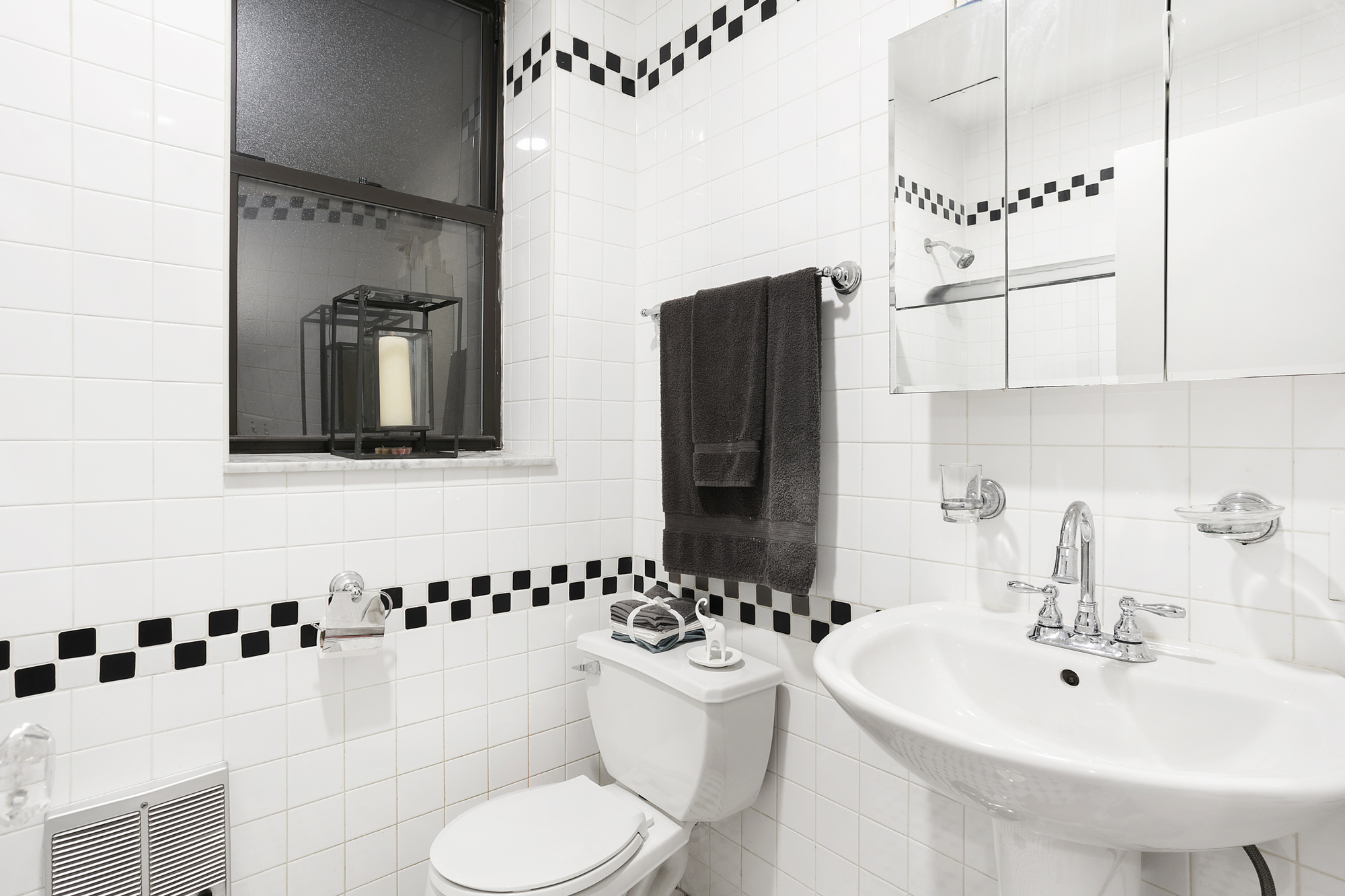 425 West 24th Street, Unit 1E Manhattan, NY 10011 - Photo 4 of 5 a bathroom with a sink toilet and shower