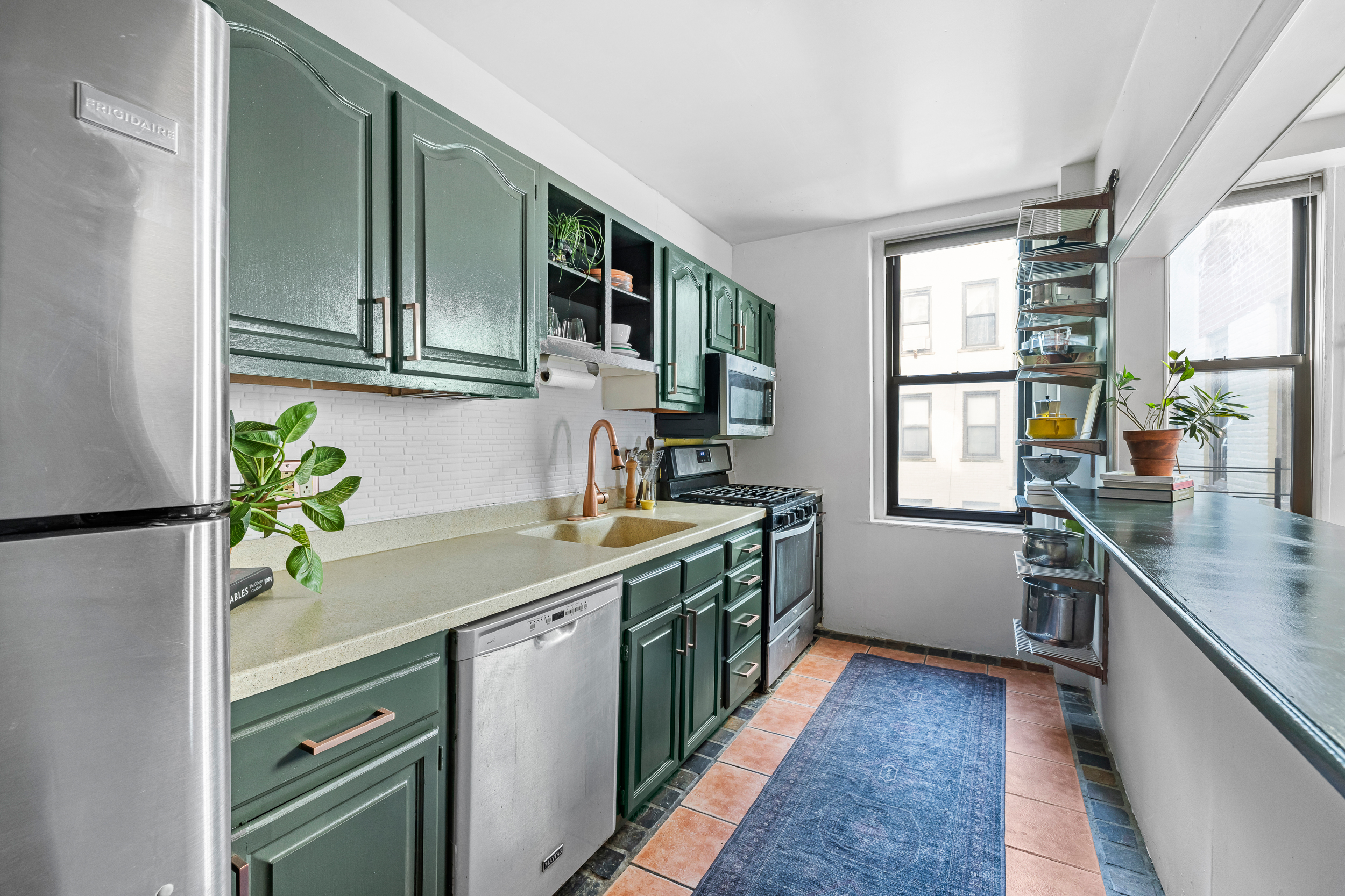 7901 4th Avenue Brooklyn, NY 11209 - Photo 3 of 10 a kitchen with a sink and a refrigerator