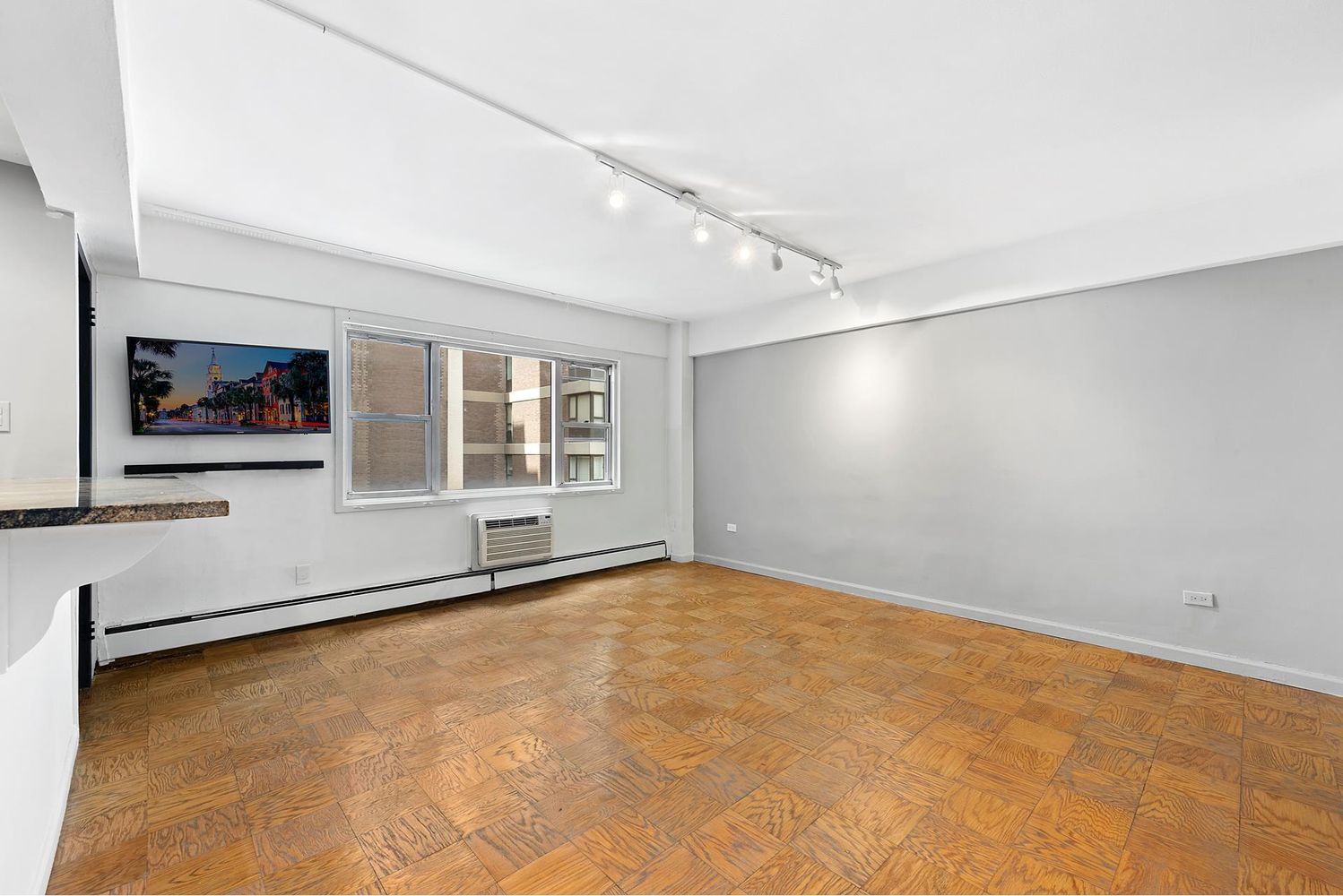 40 Sutton Place, Unit 8D Manhattan, NY 10022 - Photo 4 of 12 a view of an empty room with a window