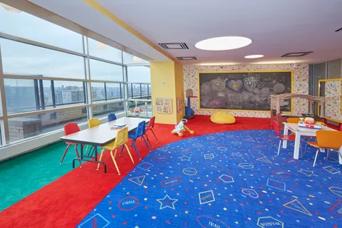 a room with chairs and pool table