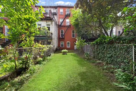 a view of a house with a yard and plants