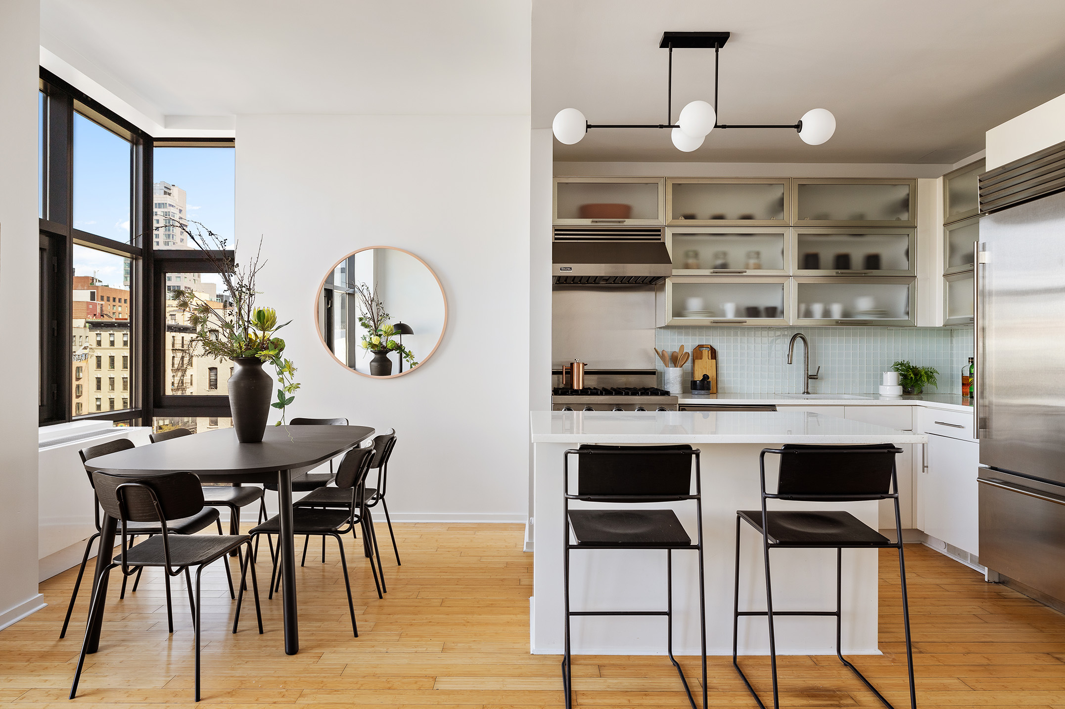 105 Norfolk Street, Unit 6A Manhattan, NY 10002 - Photo 2 of 11 a view of a dining room with furniture and wooden floor