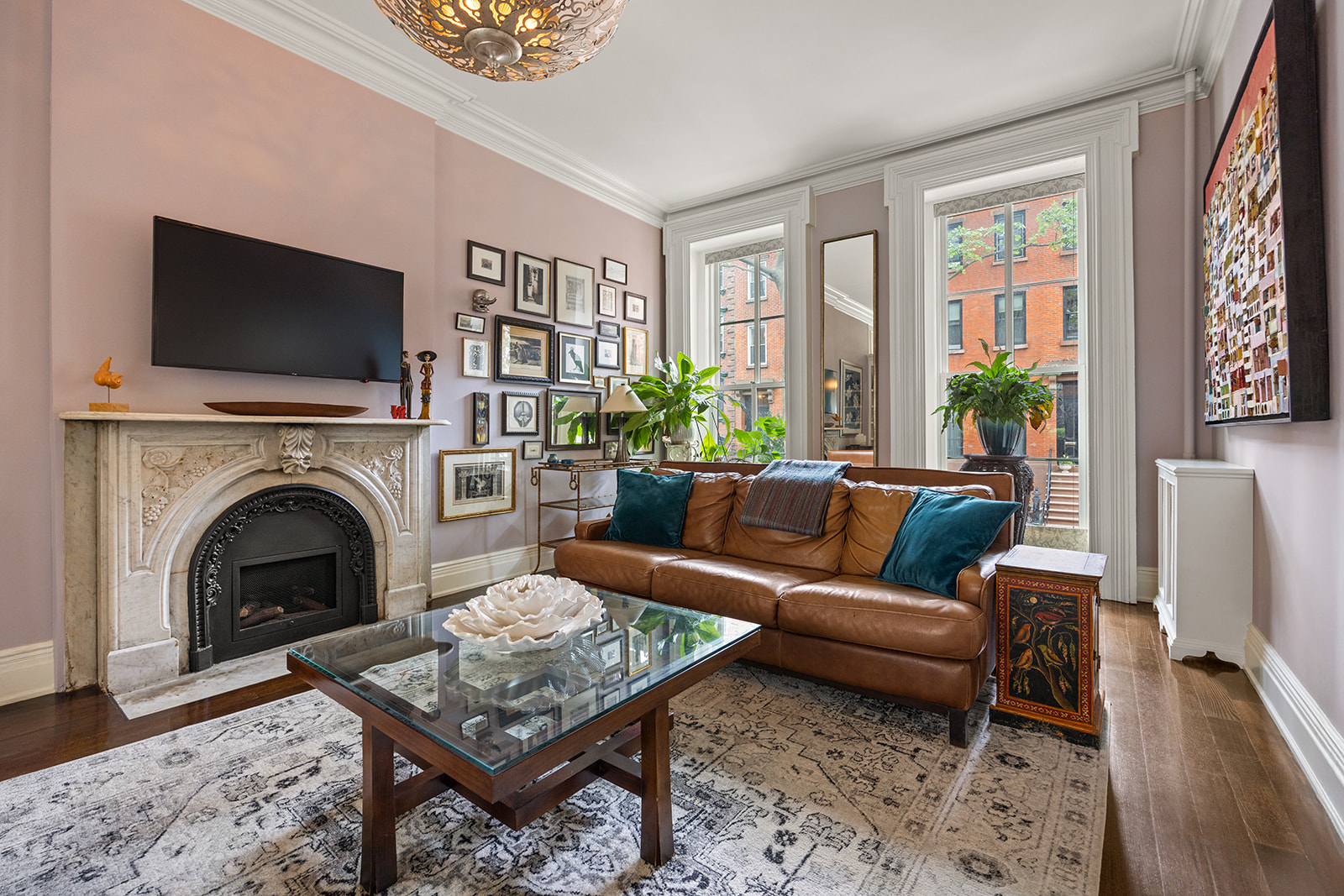 54 Cheever Place Brooklyn, NY 11231 - Photo 3 of 25 a living room with furniture a flat screen tv and a fireplace