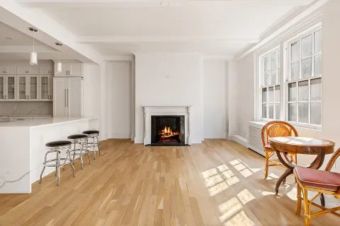 a view of a livingroom with furniture and a fireplace