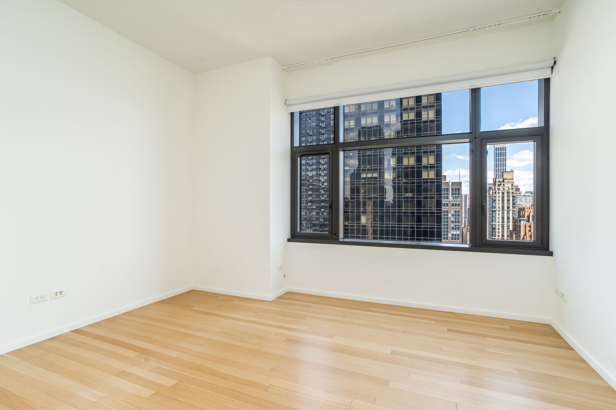 50 United Nations Plaza, Unit 26B Manhattan, NY 10017 - Photo 20 of 25 a view of wooden floor in a room