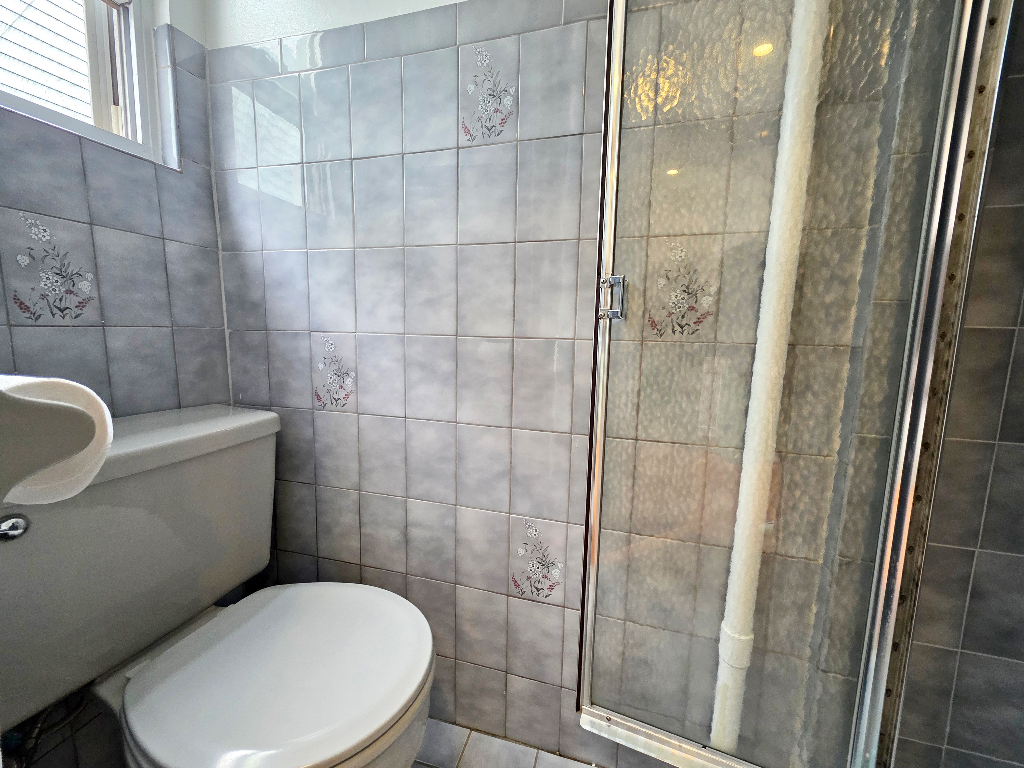 396 Manhattan Avenue, Unit 2L Brooklyn, NY 11211 - Photo 6 of 7 a white toilet sitting next to a bathroom sink