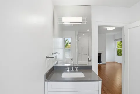 a bathroom with a sink and a mirror