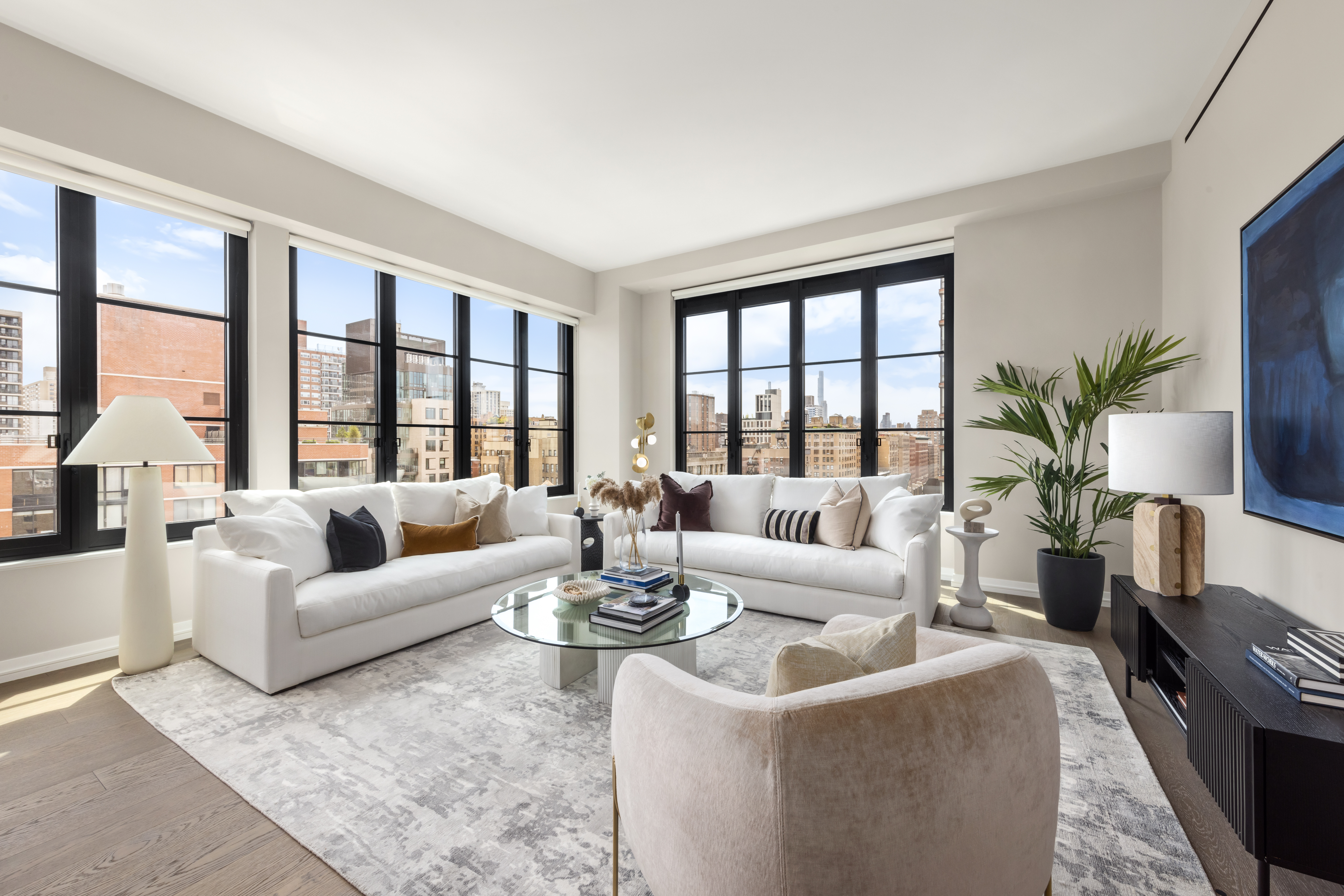 250 West 96th Street, Unit 19D Manhattan, NY 10025 - Photo 2 of 34 a living room with furniture and floor to ceiling windows