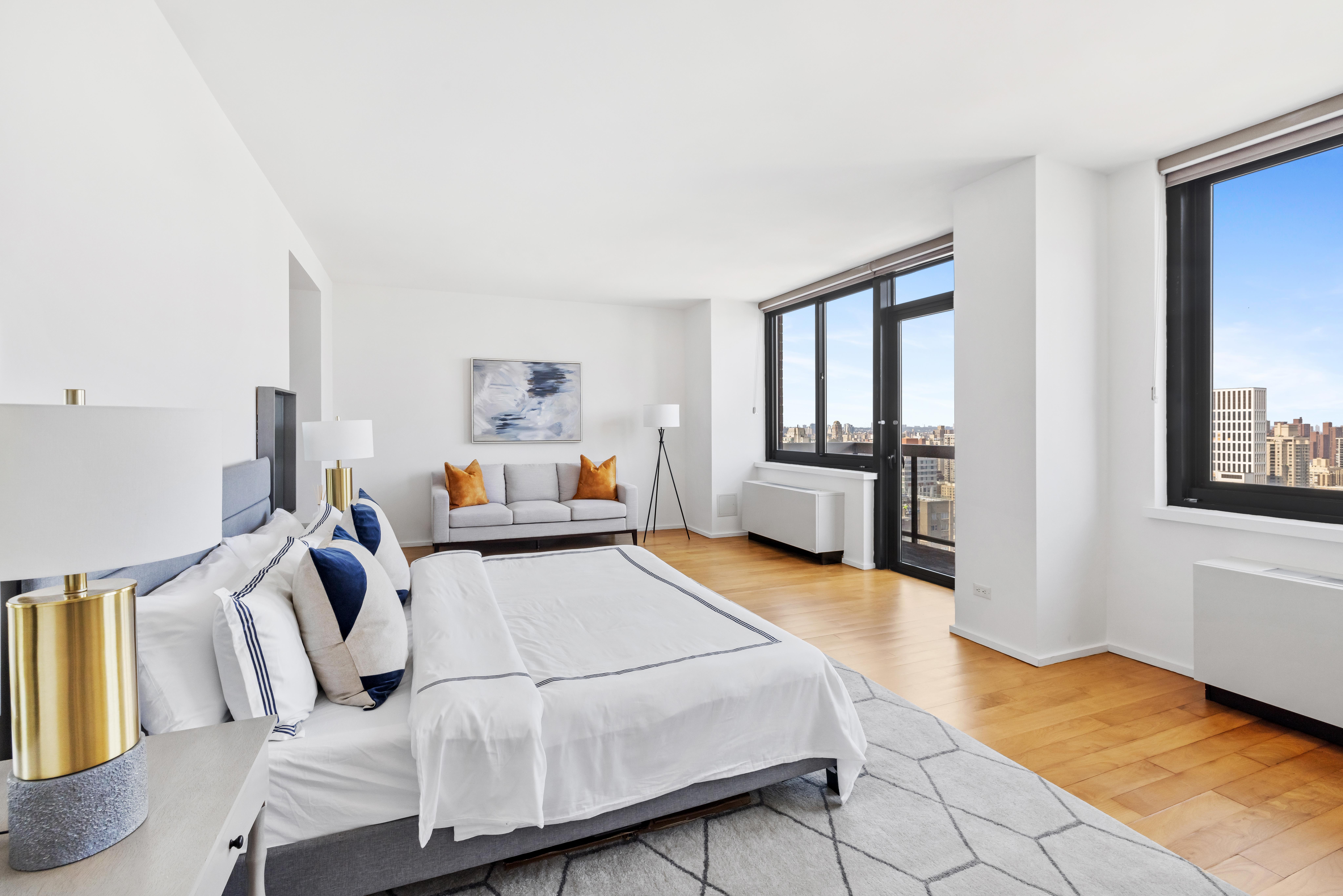 515 East 72nd Street, Unit 40E Manhattan, NY 10021 - Photo 9 of 34 a bedroom with furniture and wooden floor