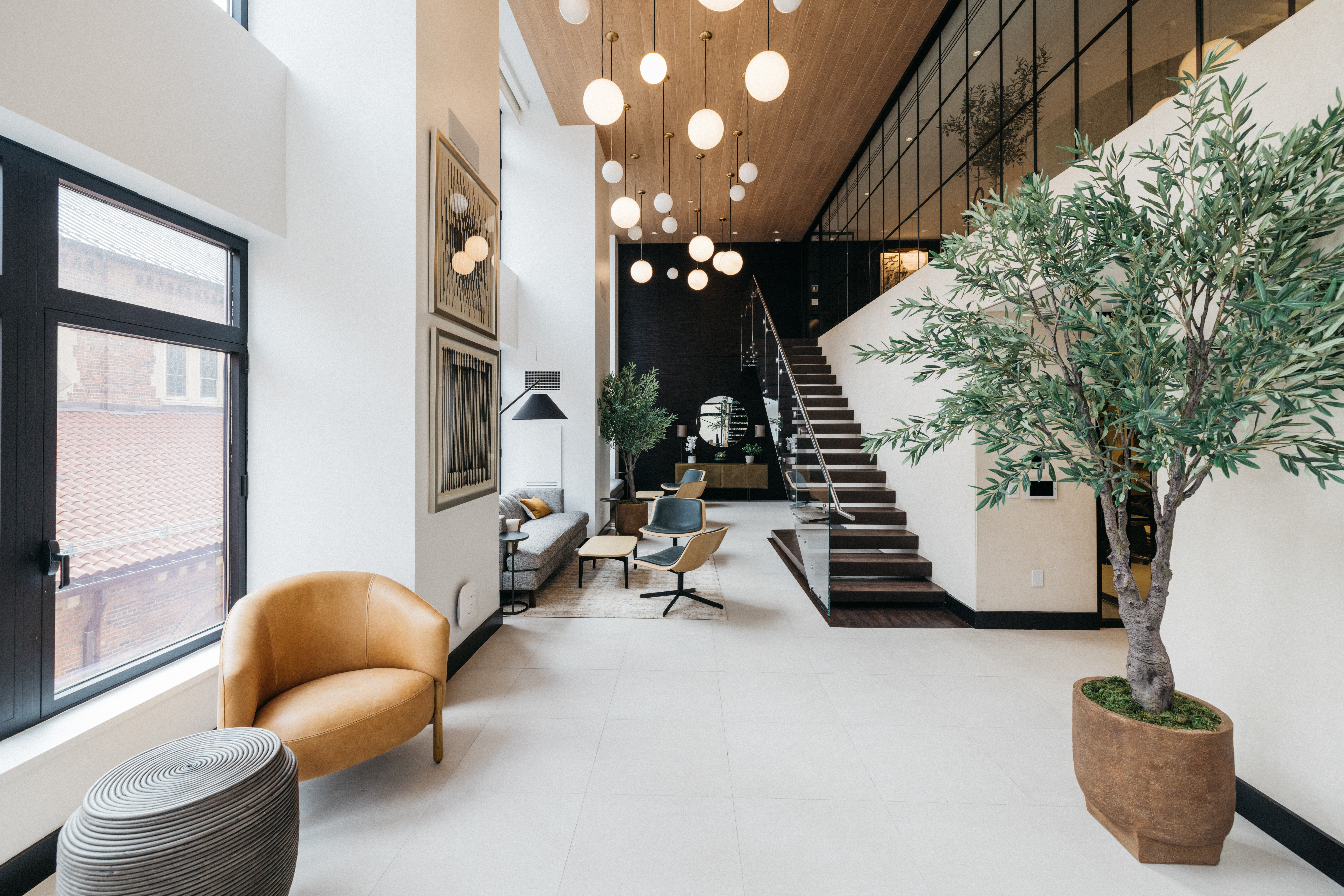 400 East 67th Street, Unit 7G Manhattan, NY 10065 - Photo 10 of 20 a living room with furniture and a potted plant