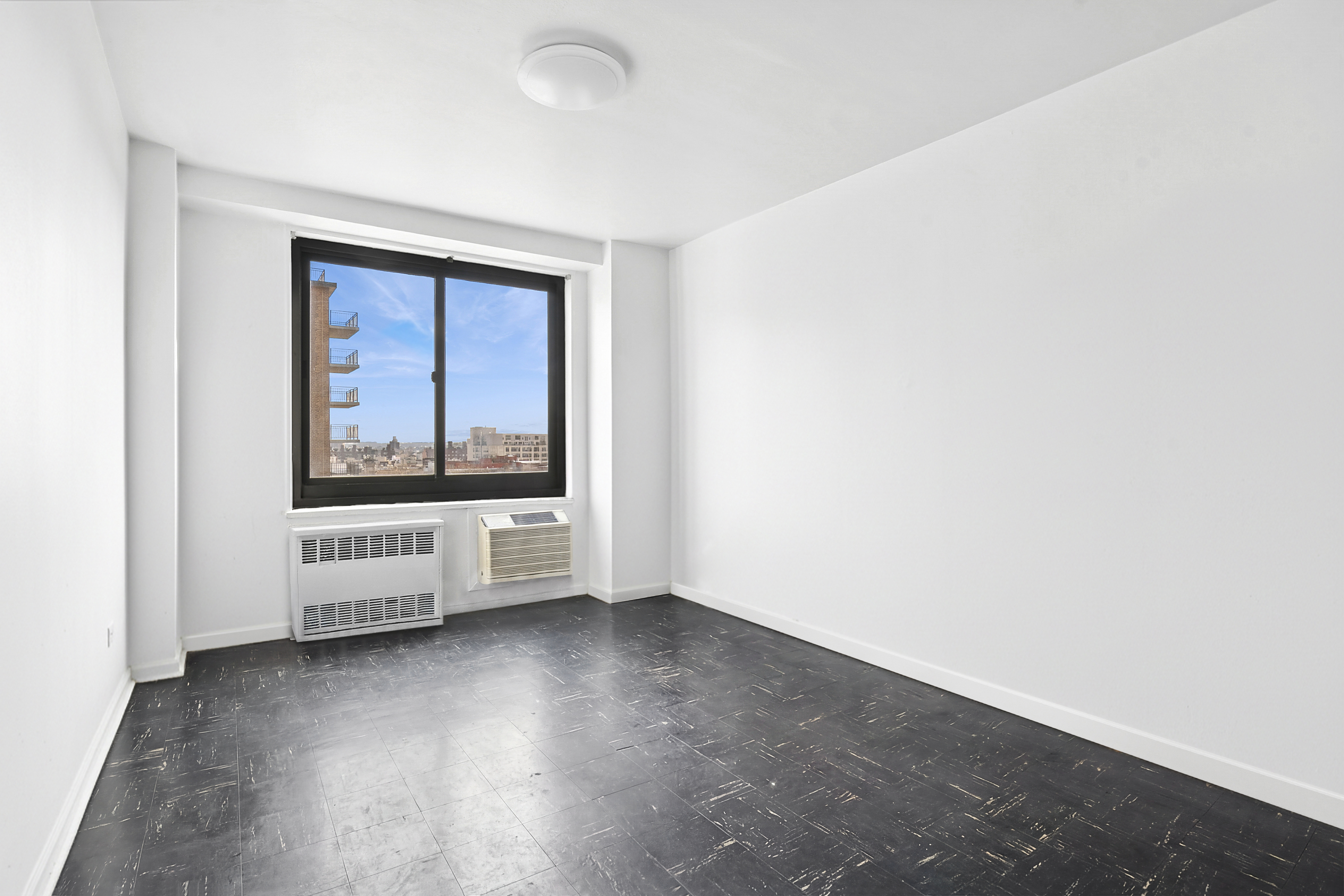 195 Willoughby Avenue, Unit 1206 Brooklyn, NY 11205 - Photo 6 of 10 a view of an empty room with a window