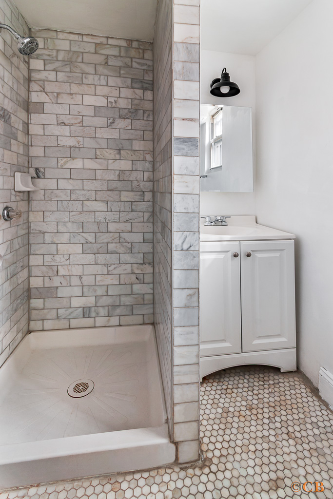 149 Van Buren Street, Unit GARDEN Brooklyn, NY 11221 - Photo 4 of 6 a bathroom with a bathtub