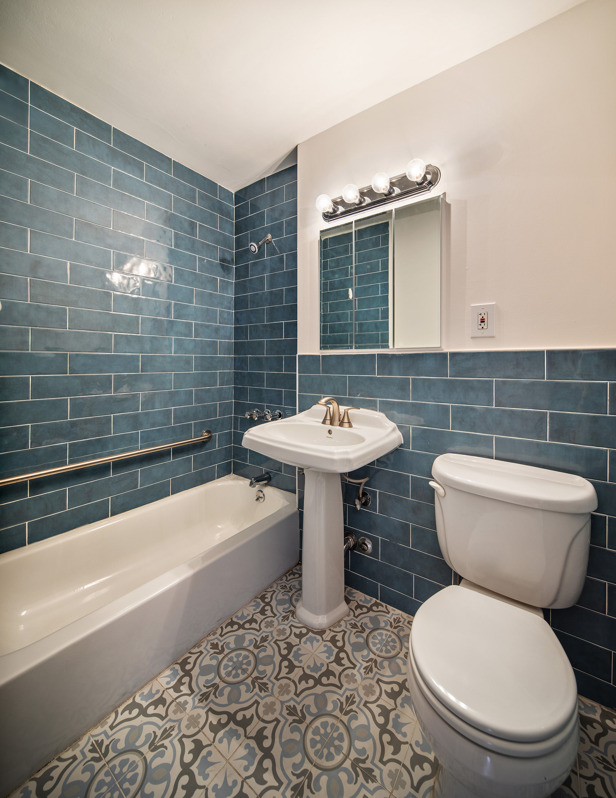 85 Livingston Street, Unit 3H Brooklyn, NY 11201 - Photo 8 of 9 a bathroom with a sink toilet and shower