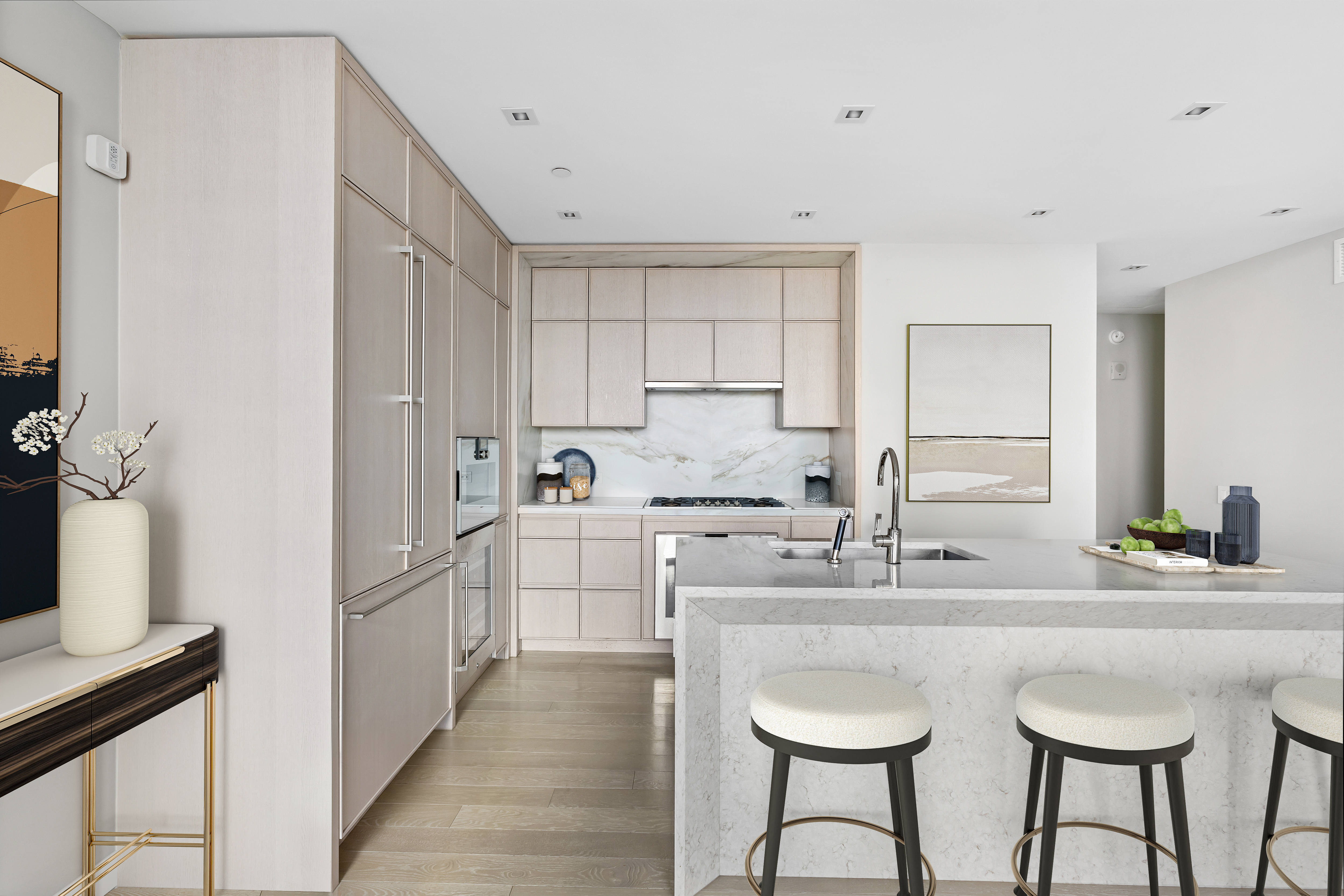 138 East 50th Street, Unit 40B Manhattan, NY 10022 - Photo 4 of 22 a kitchen with stainless steel appliances a sink stove and white cabinets with wooden floor