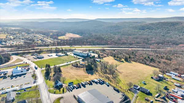 an aerial view of residential houses with outdoor space