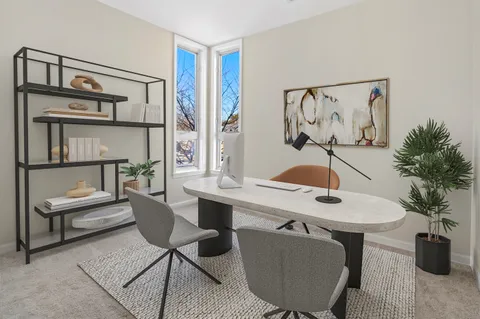 a room with furniture and a potted plant