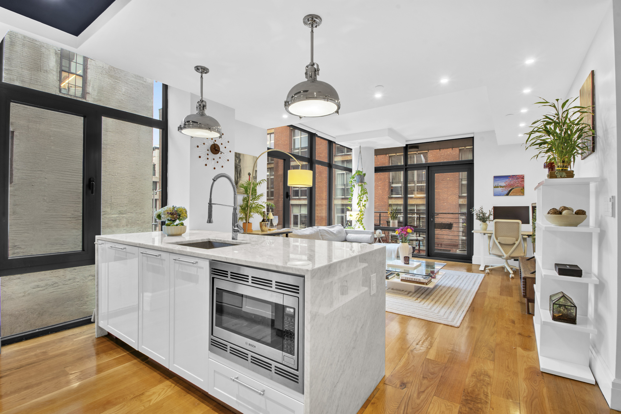 47 Bridge Street, Unit 3D Brooklyn, NY 11201 - Photo 4 of 27 a kitchen with stainless steel appliances granite countertop a stove and a large window