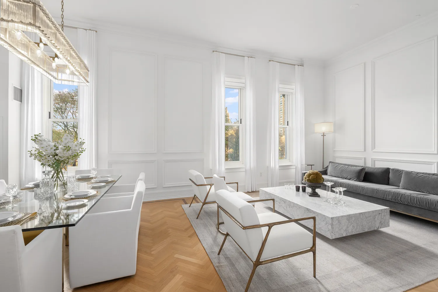 a living room with furniture and a large mirror