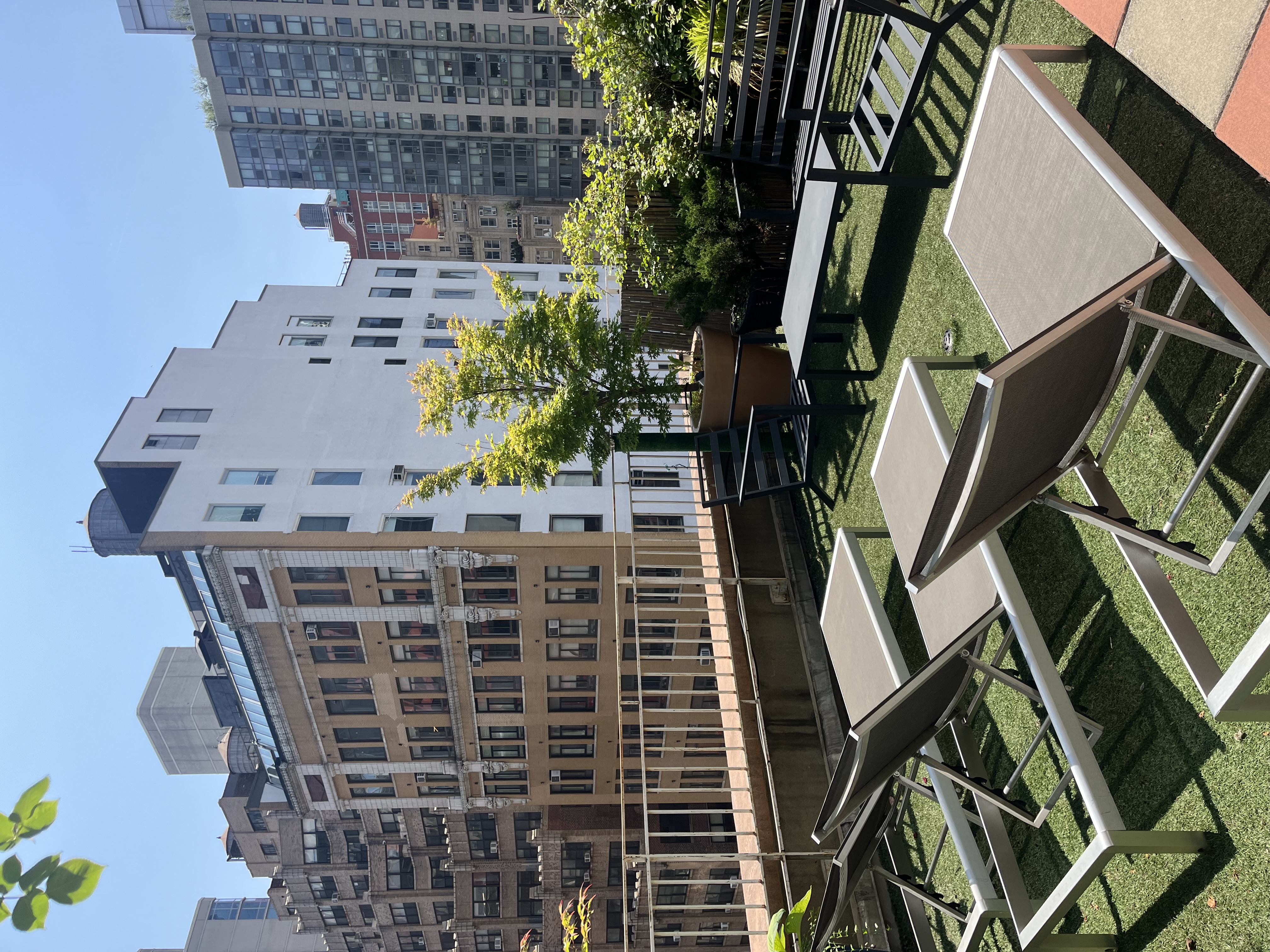 502 9th Avenue, Unit 4A Manhattan, NY 10018 - Photo 6 of 9 a view of a building with a backyard and sitting area