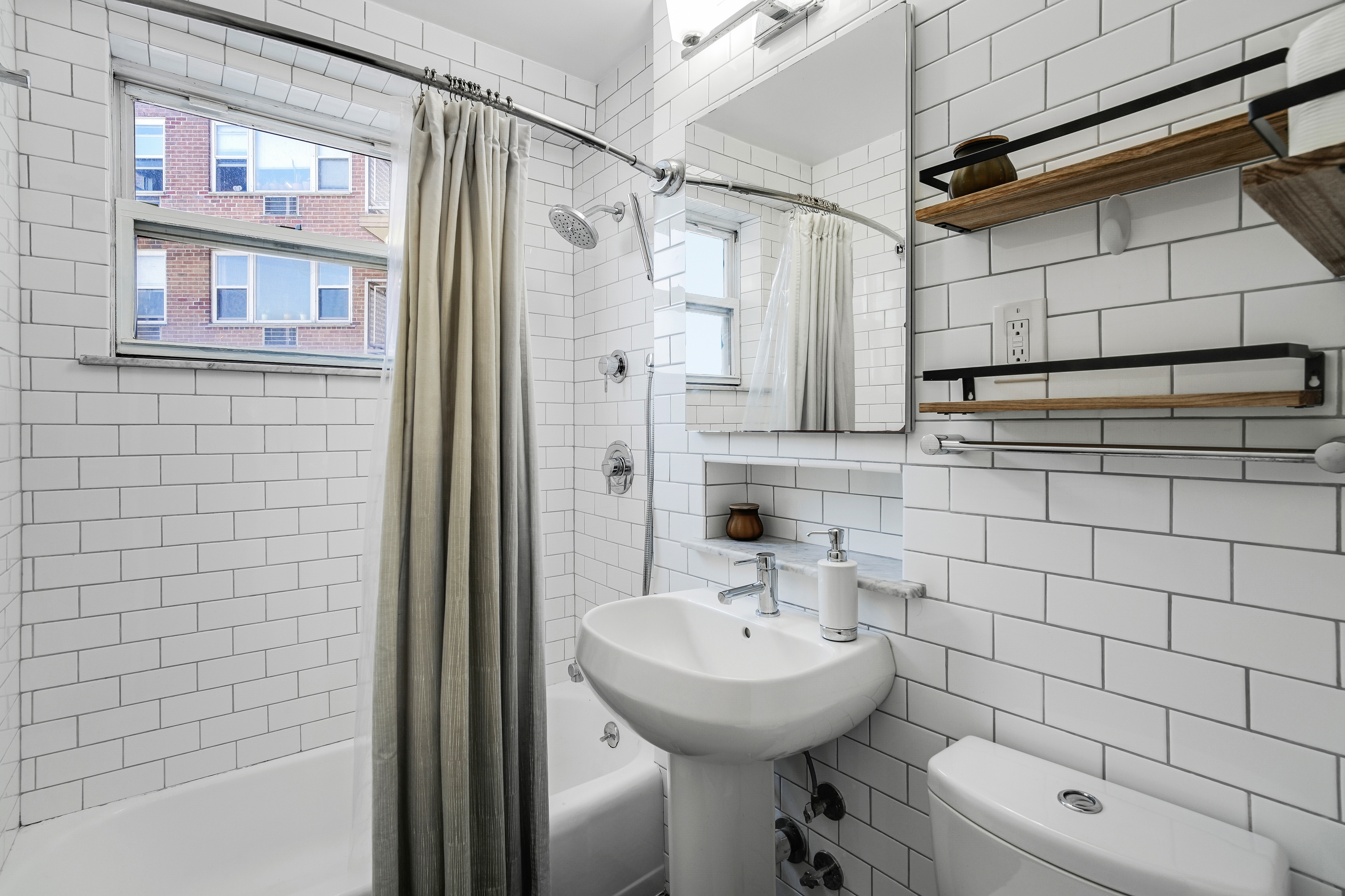 5900 Arlington Avenue, Unit 17W Bronx, NY 10471 - Photo 8 of 14 a bathroom with a sink shower and toilet
