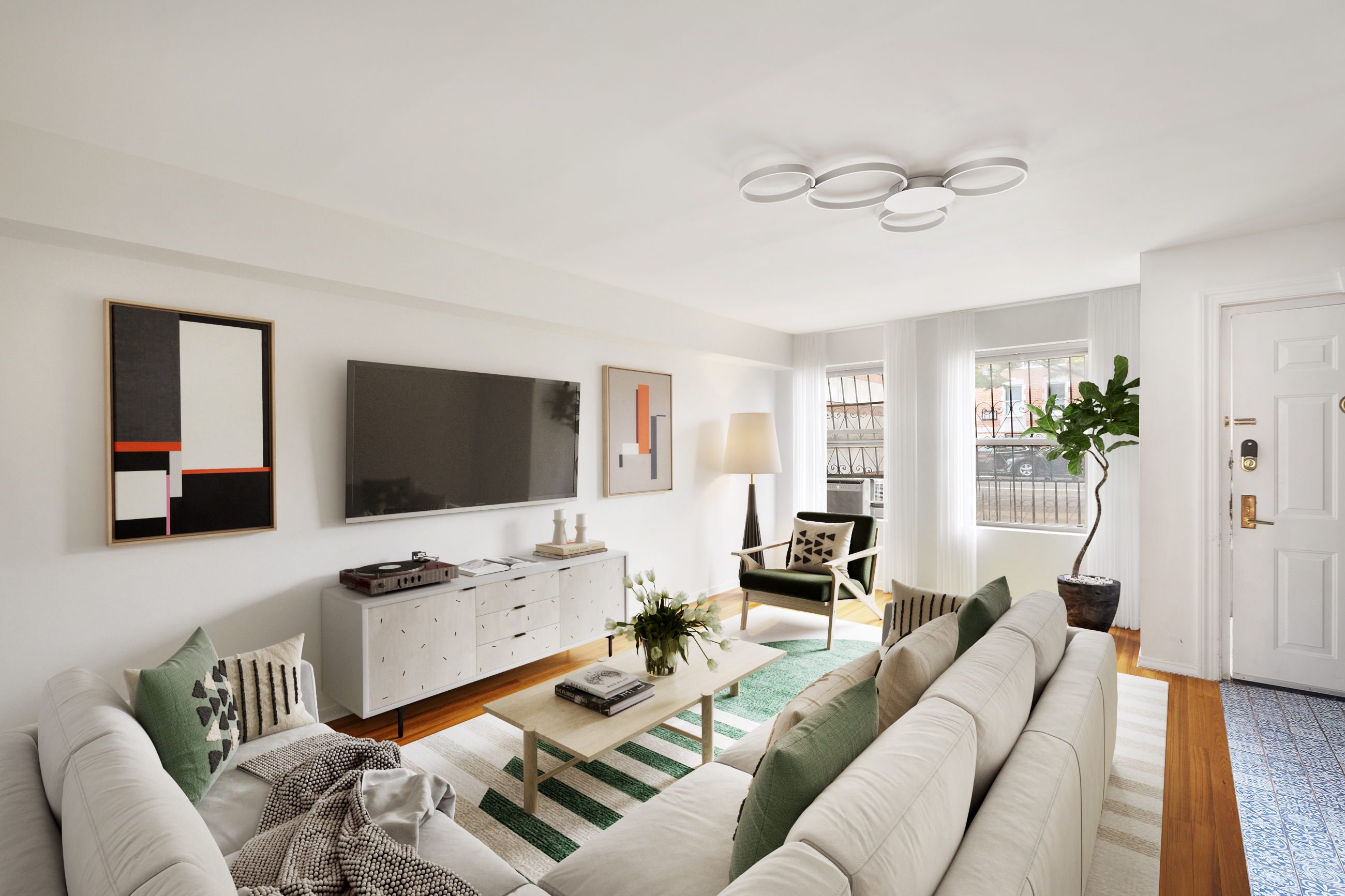 2551 Frederick Douglass Boulevard, Unit B Manhattan, NY 10030 - Photo 1 of 9 a living room with furniture and a flat screen tv