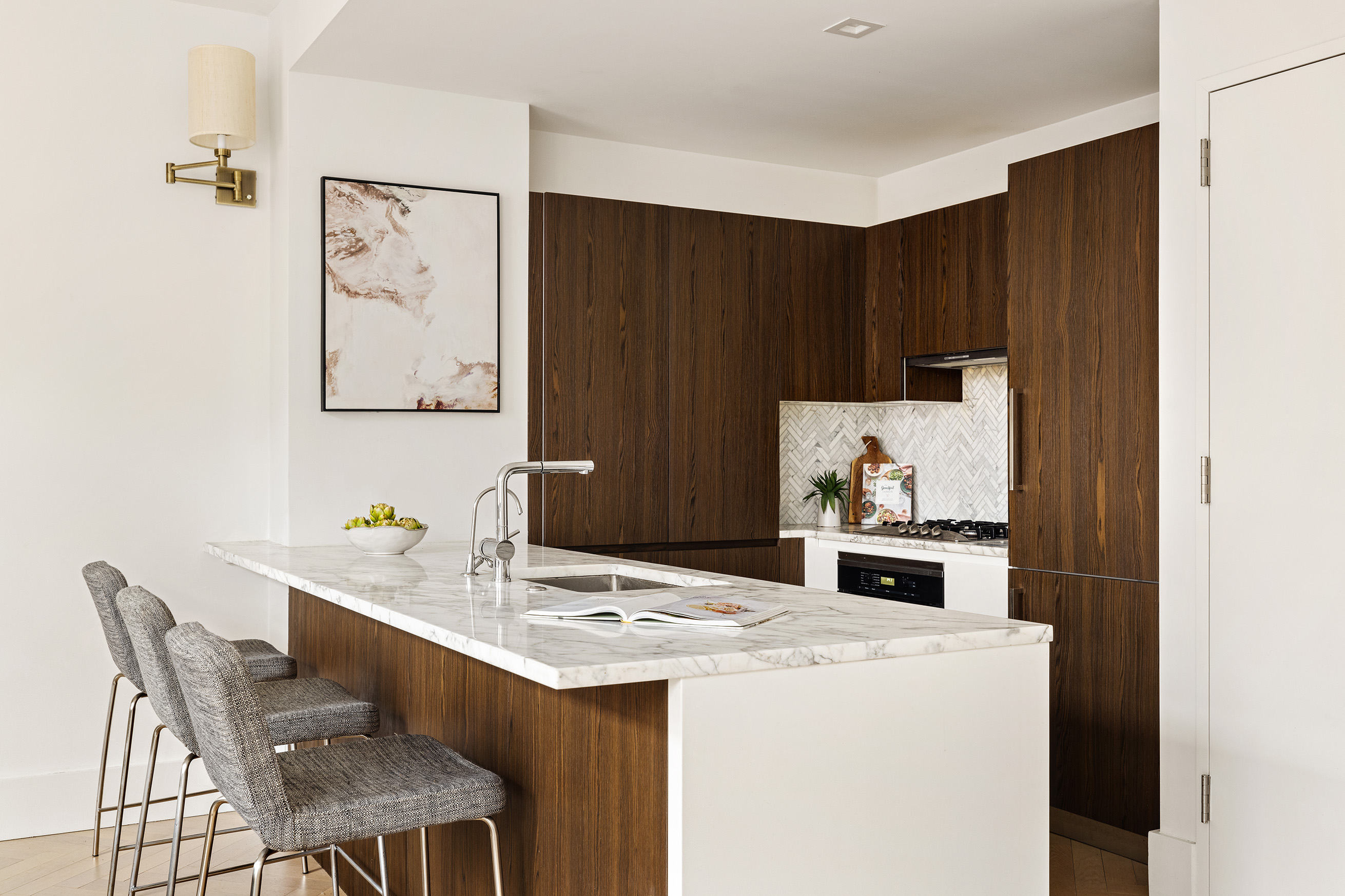 100 Avenue A, Unit 4B Manhattan, NY 10009 - Photo 4 of 11 a kitchen with a dining table chairs and white appliances
