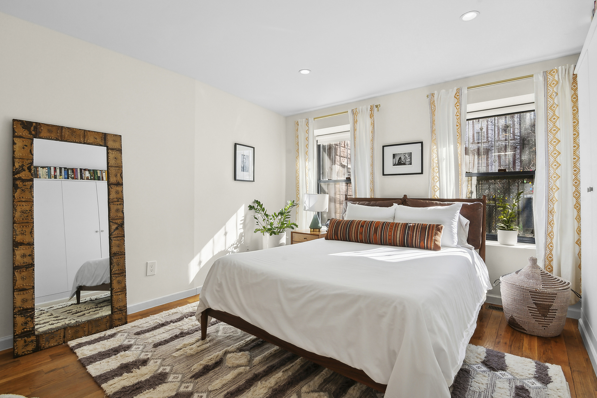 147 Herkimer Street Brooklyn, NY 11216 - Photo 13 of 25 a bedroom with a bed and wooden floor