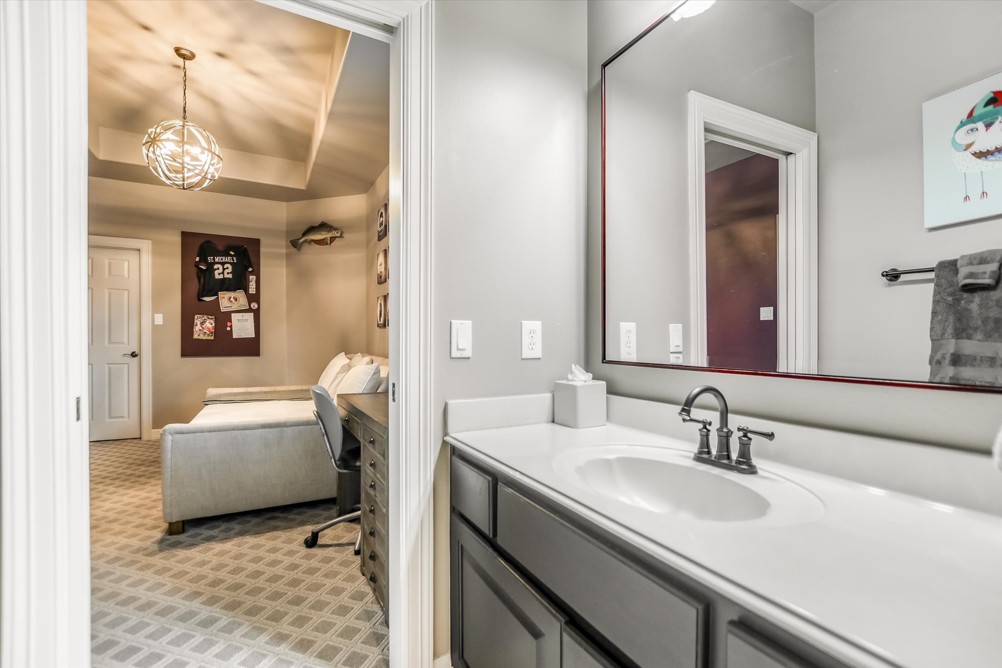 1422 Palomino Ridge Drive Austin, TX 78733 - Photo 38 of 60 a en suite bathroom with a sink and a mirror