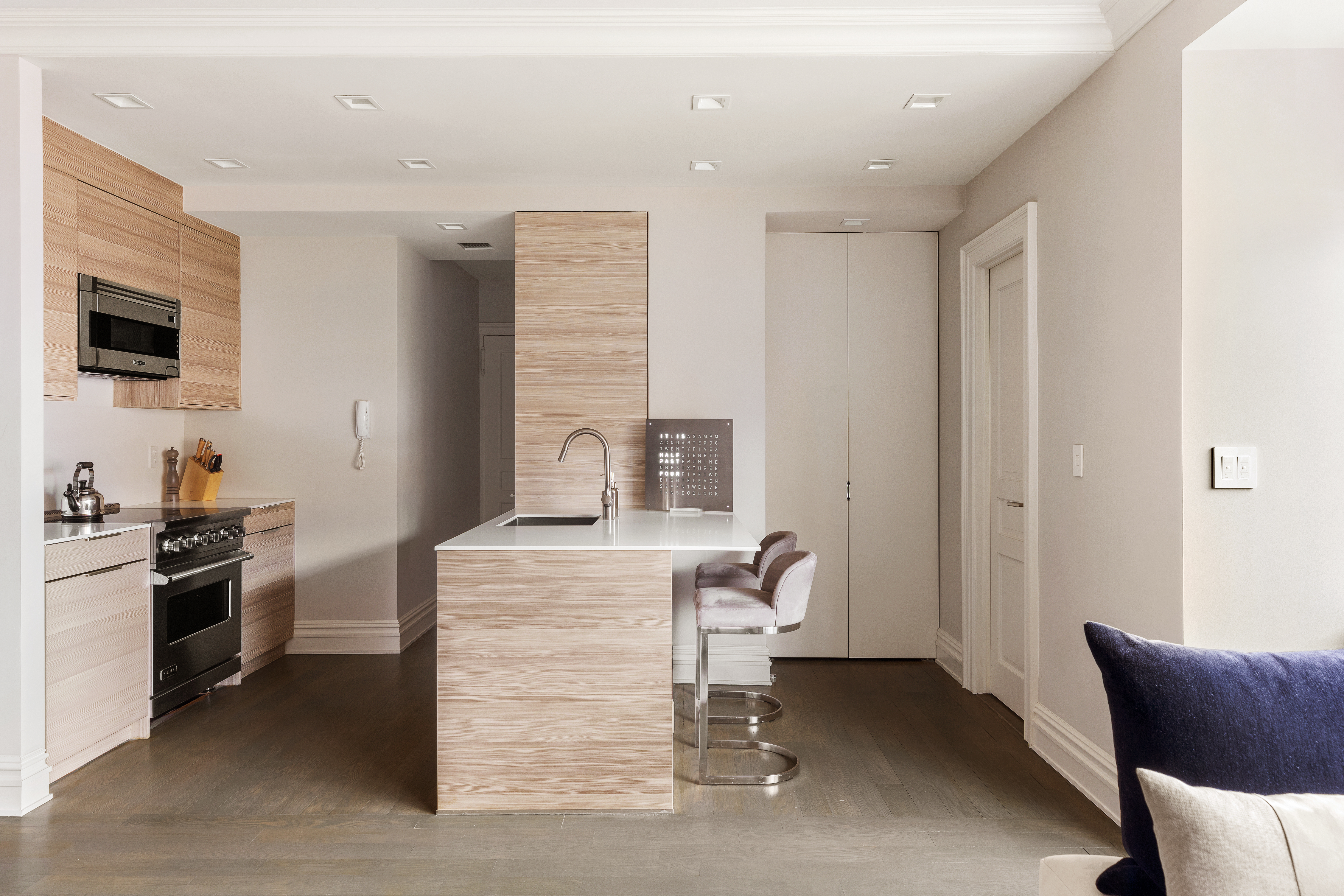 25 East 83rd Street, Unit 10D Manhattan, NY 10028 - Photo 7 of 17 a room with furniture a flat screen tv and appliances