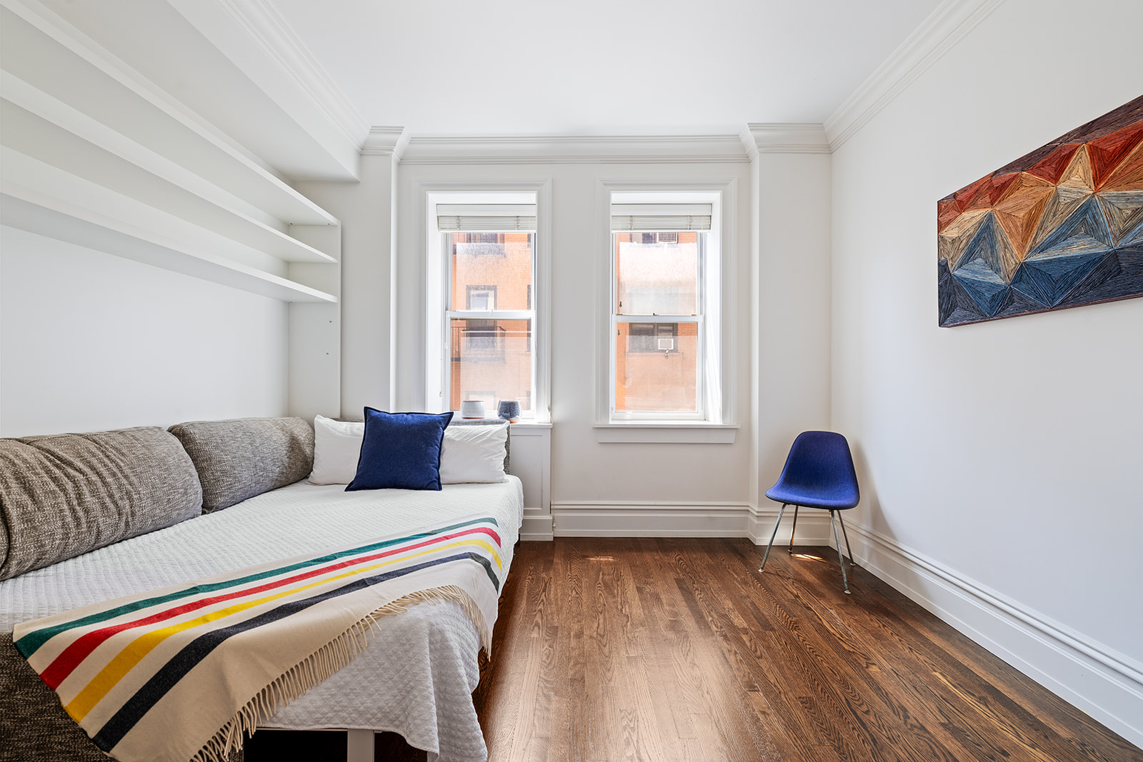 610 West 110th Street, Unit 4D Manhattan, NY 10025 - Photo 7 of 12 a bedroom with a bed and a chair