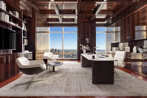 a living room with couches and a dining table with kitchen view