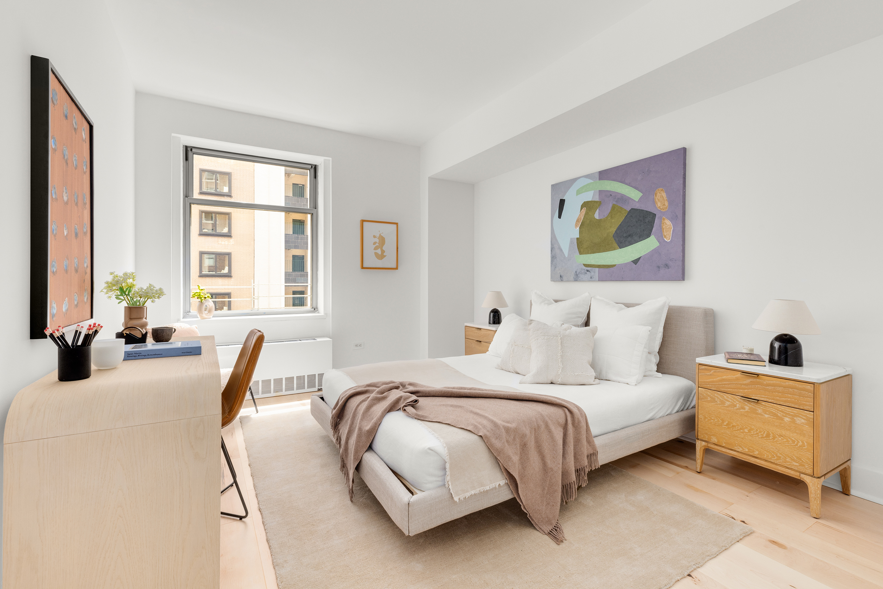 100 West 58th Street, Unit 8C Manhattan, NY 10019 - Photo 9 of 11 a bedroom with a bed and glass windows