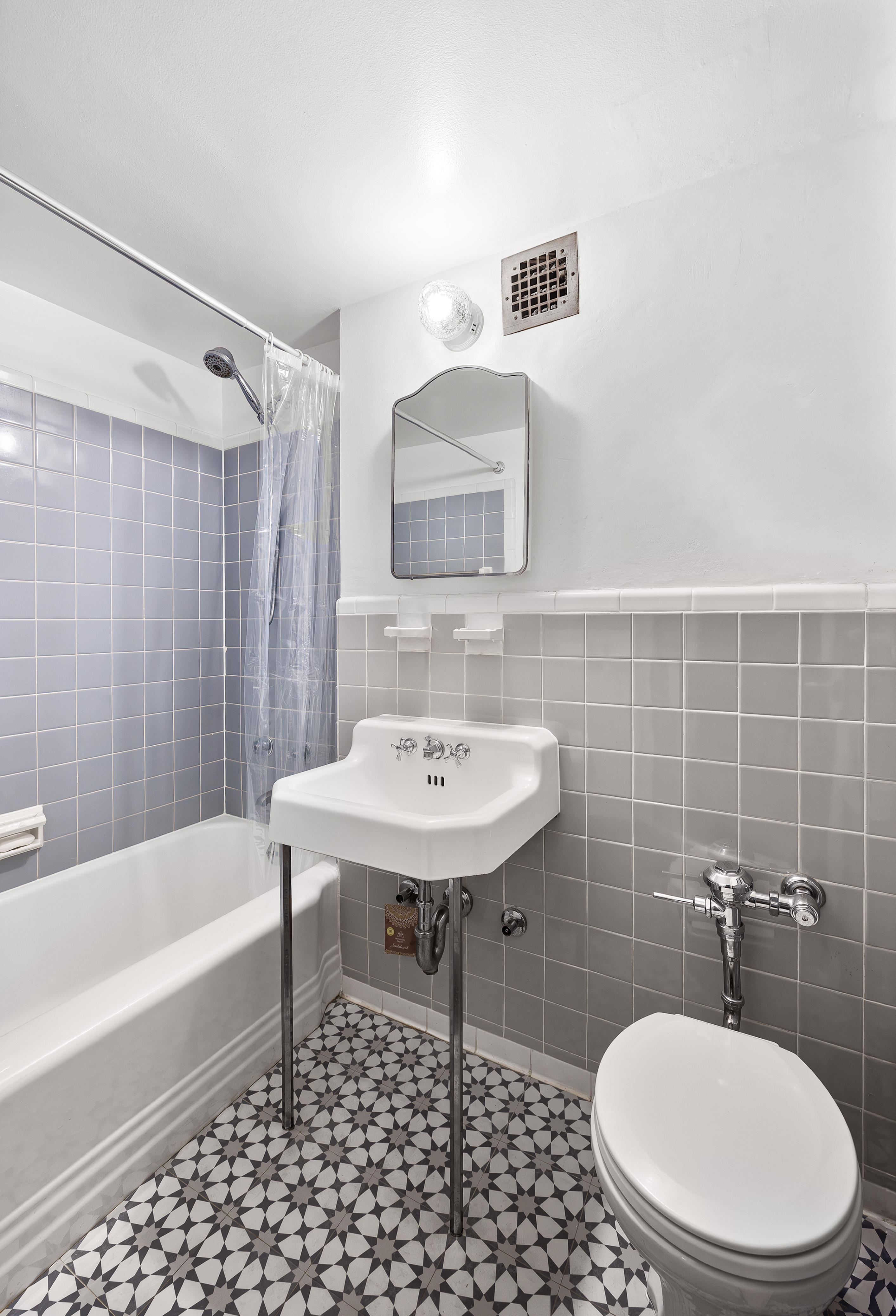 35-51 85th Street, Unit 9N Queens, NY 11372 - Photo 8 of 10 a bathroom with a sink toilet and shower