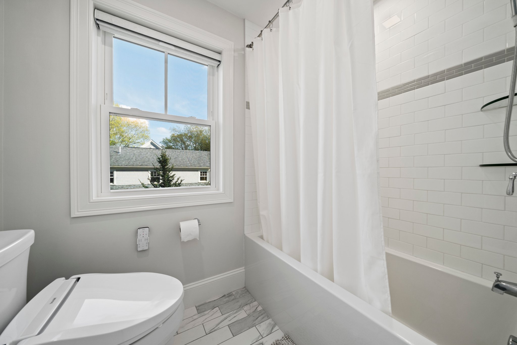 241 Lowell Road Wellesley, MA 02481 - Photo 29 of 85 a bathroom with a toilet a sink and a bathtub