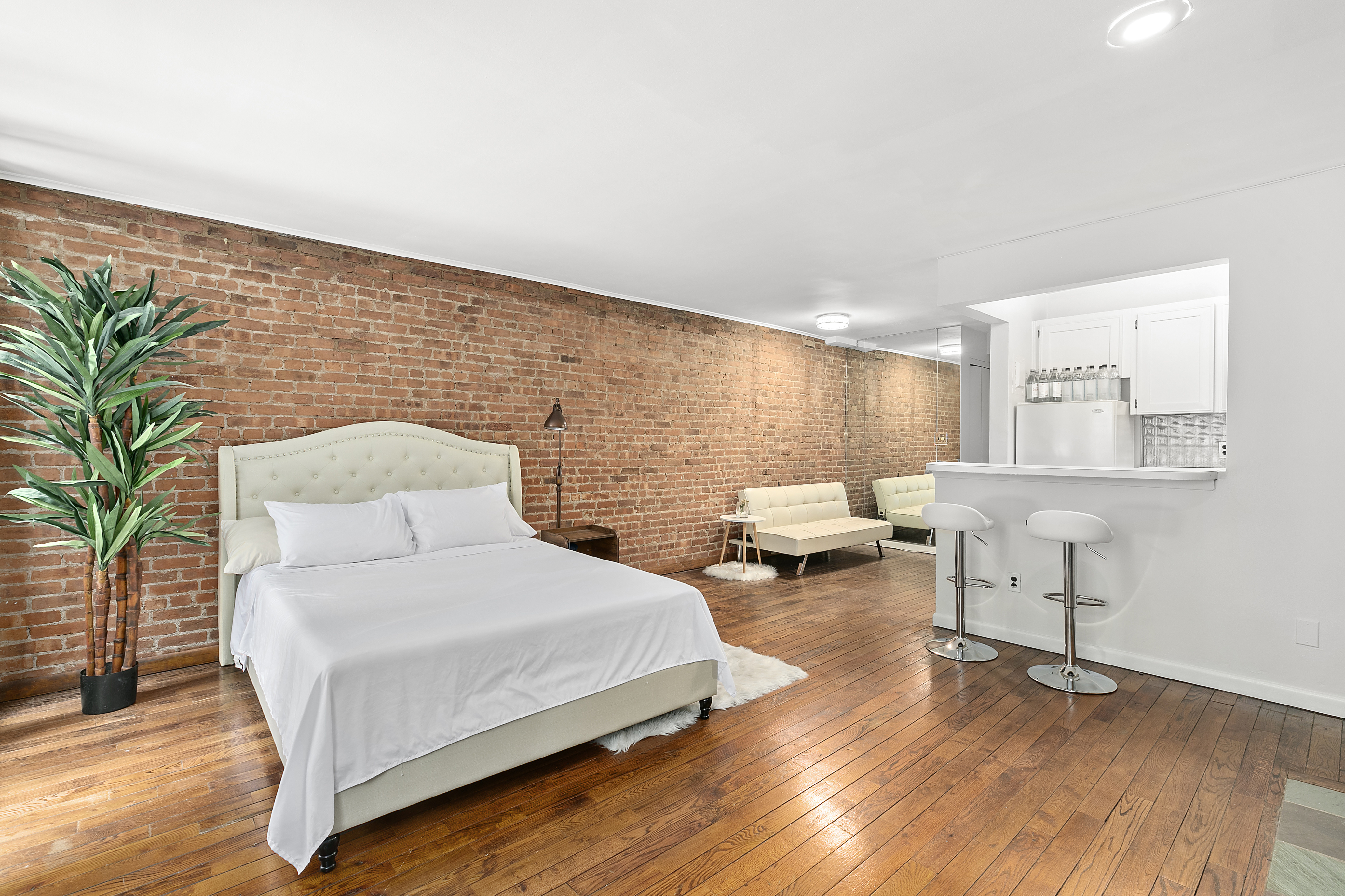 59 East 74th Street, Unit 8 Manhattan, NY 10021 - Photo 3 of 5 a spacious bedroom with a bed and window