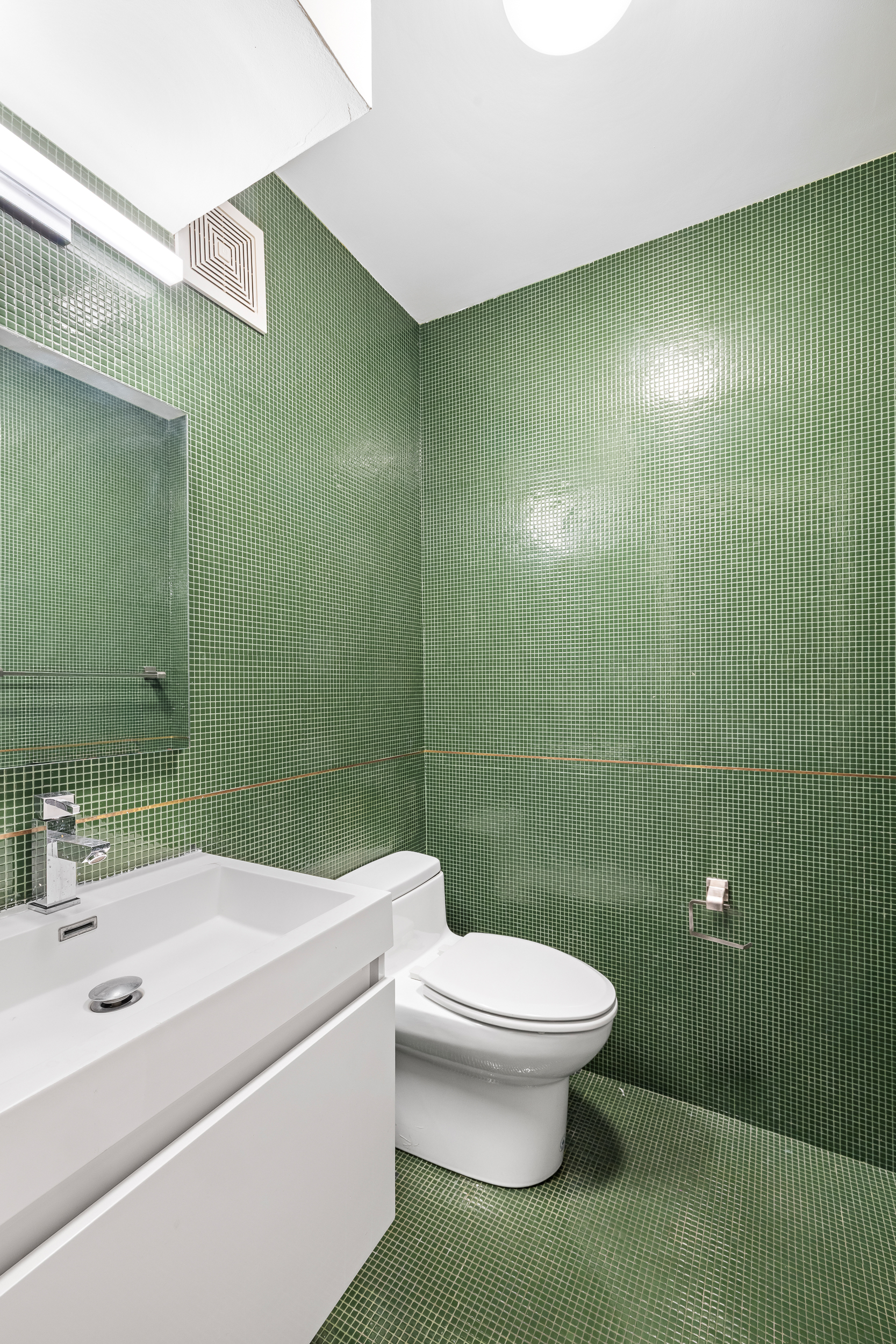 240 West 23rd Street, Unit 3/4C Manhattan, NY 10011 - Photo 11 of 13 a bathroom with a sink a toilet and shower