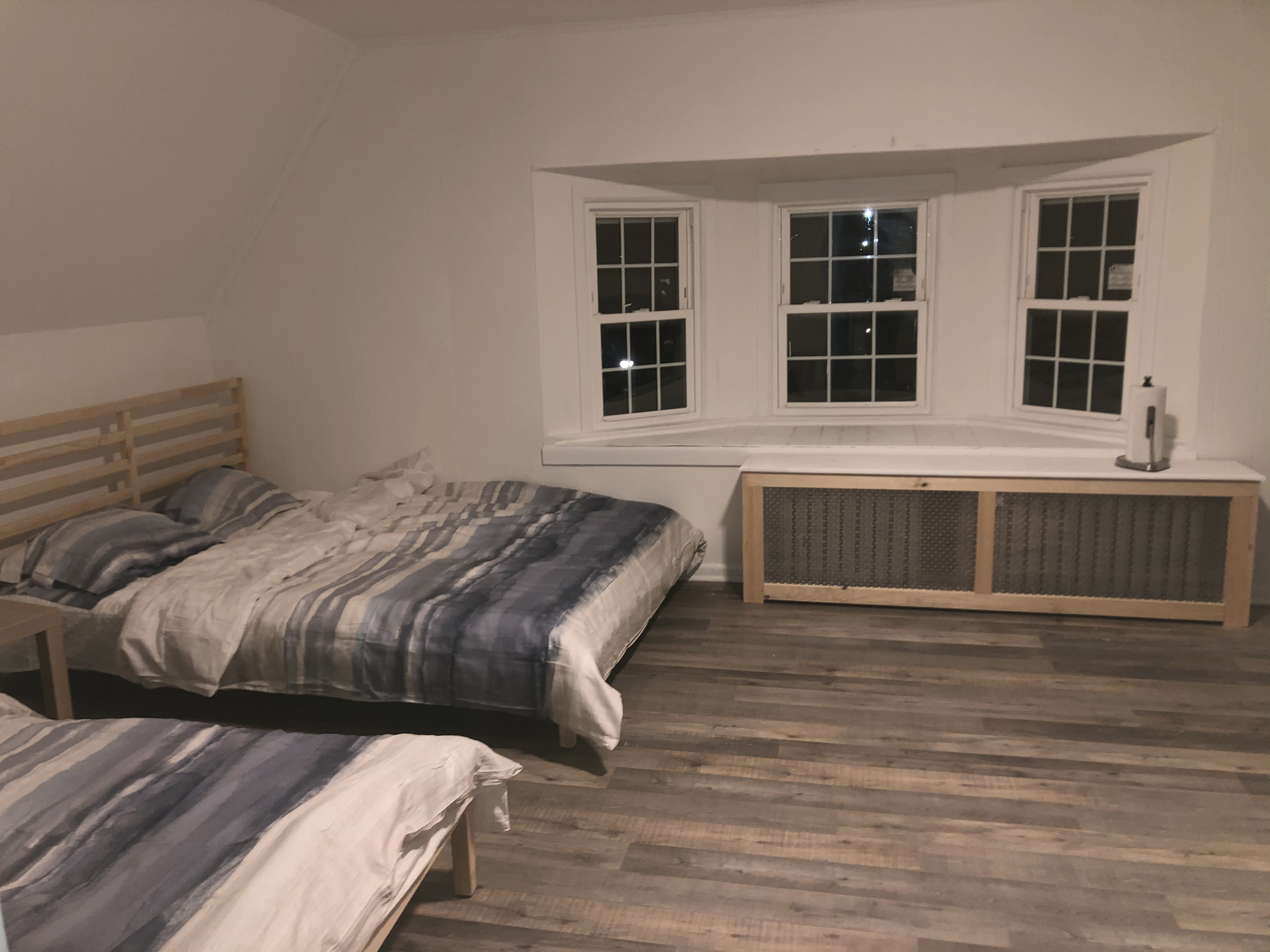 1112 Beverley Road Brooklyn, NY 11218 - Photo 7 of 53 a bed sitting in a bedroom next to a window and more cabinets