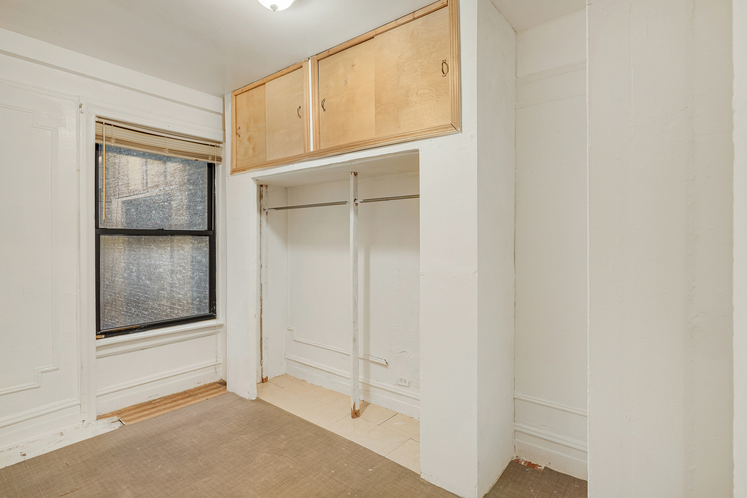 544 West 157th Street, Unit 44 Manhattan, NY 10032 - Photo 7 of 9 a view of an empty room with closet area