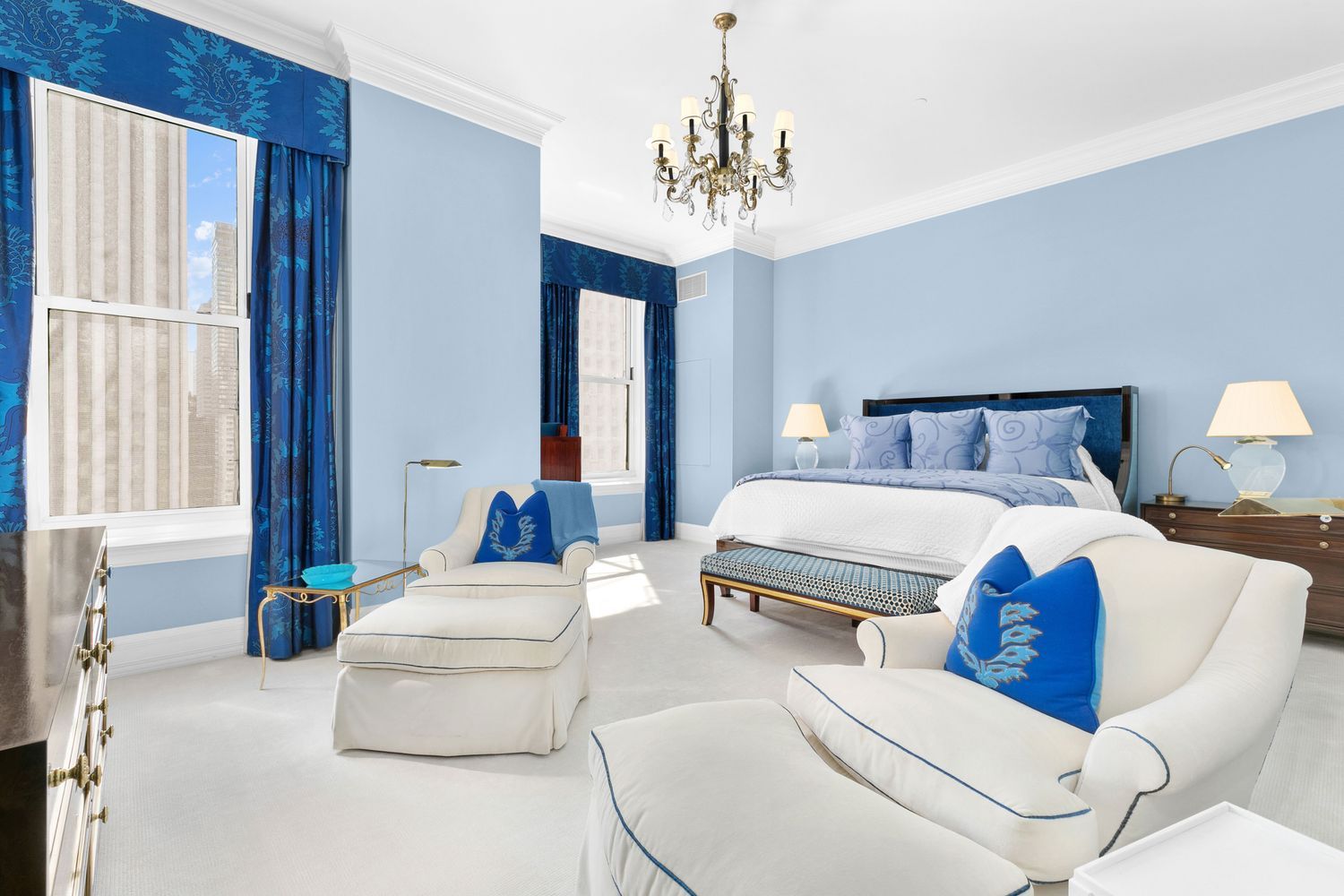 1 Central Park South, Unit 909913 Manhattan, NY 10019 - Photo 17 of 38 a bedroom with a large bed and a chandelier