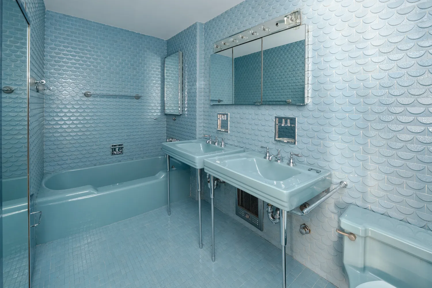 a bathroom with a sink toilet tub and shower