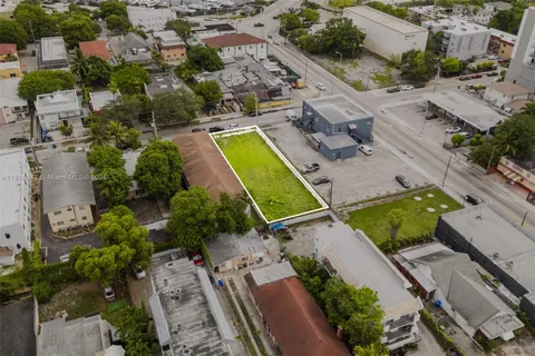an aerial view of a house with a swimming pool
