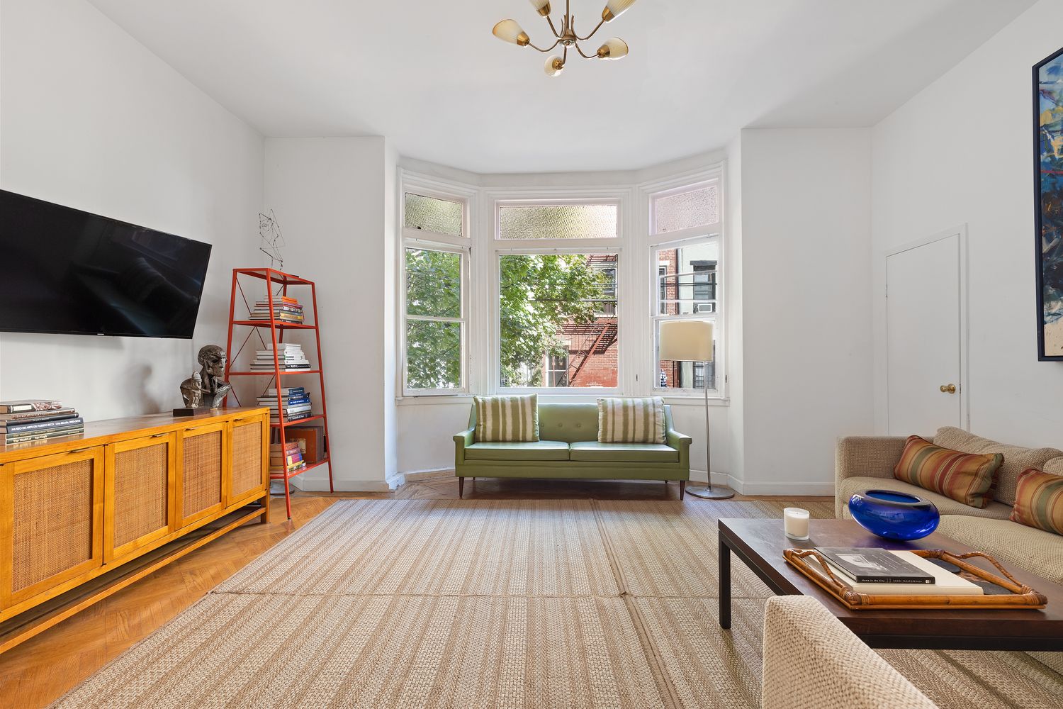 315 Washington Avenue Brooklyn, NY 11205 - Photo 12 of 38 a living room with furniture and a flat screen tv