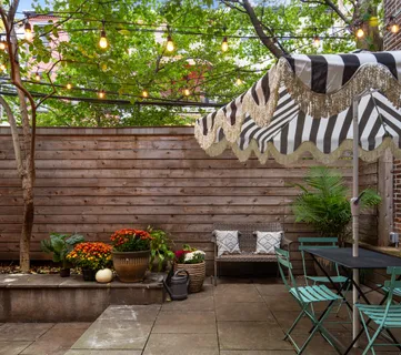 a view of a patio with couple of chairs in a patio