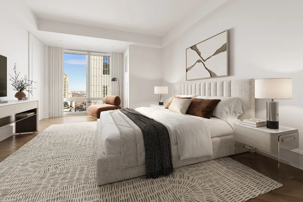a bedroom with a large bed and a chandelier