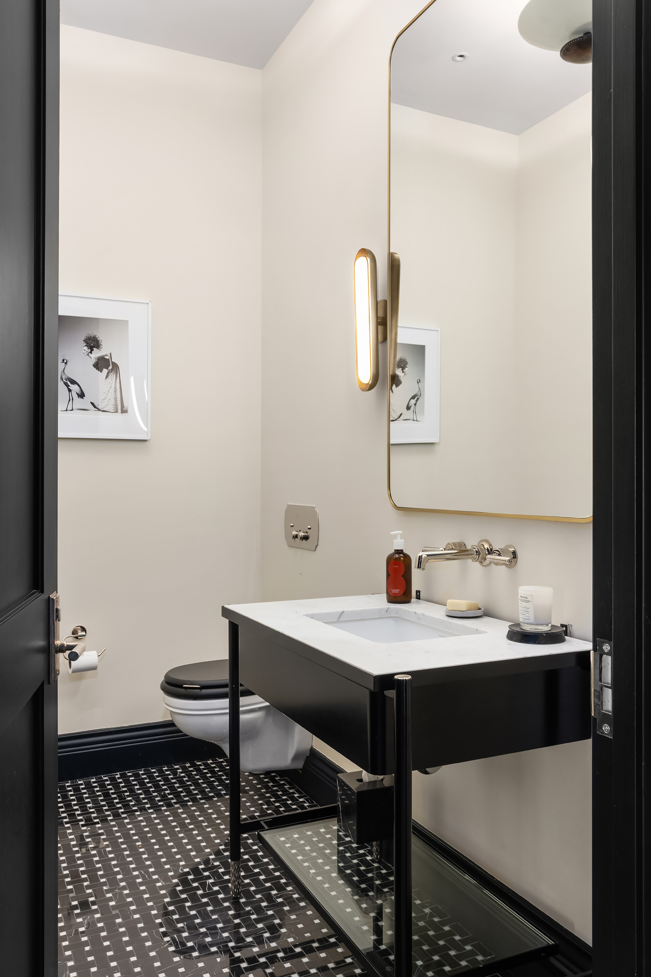 158 Mercer Street, Unit 6B Manhattan, NY 10012 - Photo 15 of 16 a bathroom with a sink and a mirror